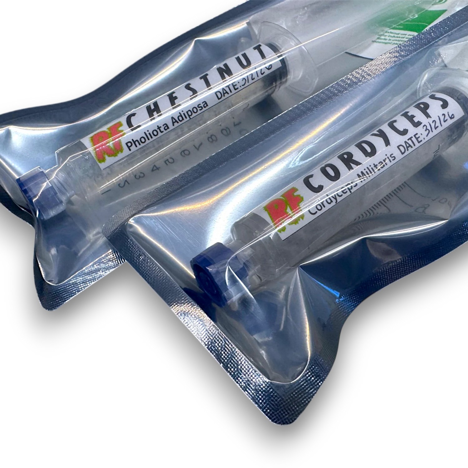 Aerated liquid cultures of Nameko and Shiitake mushrooms in syringes.