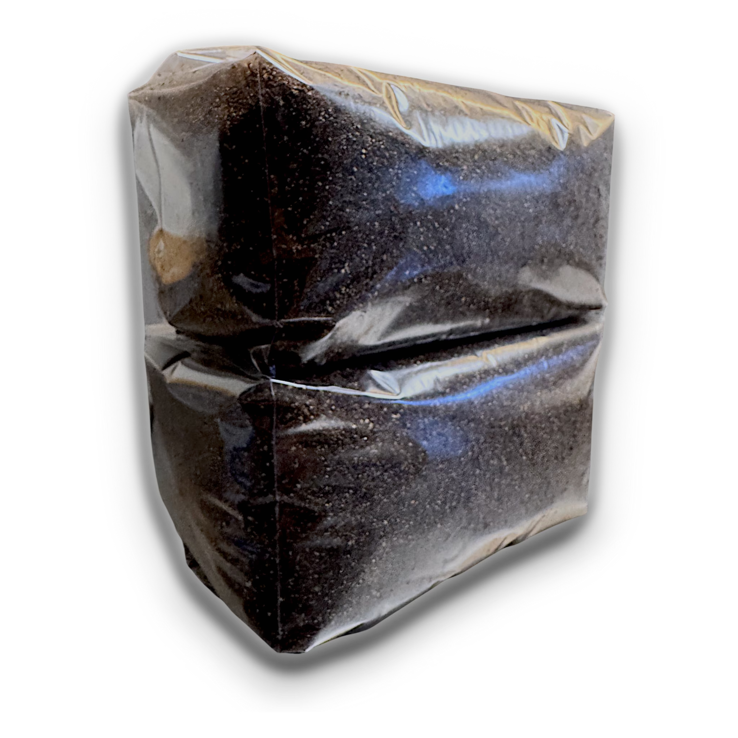 Two bags of mushroom substrate stacked on each other on a white background