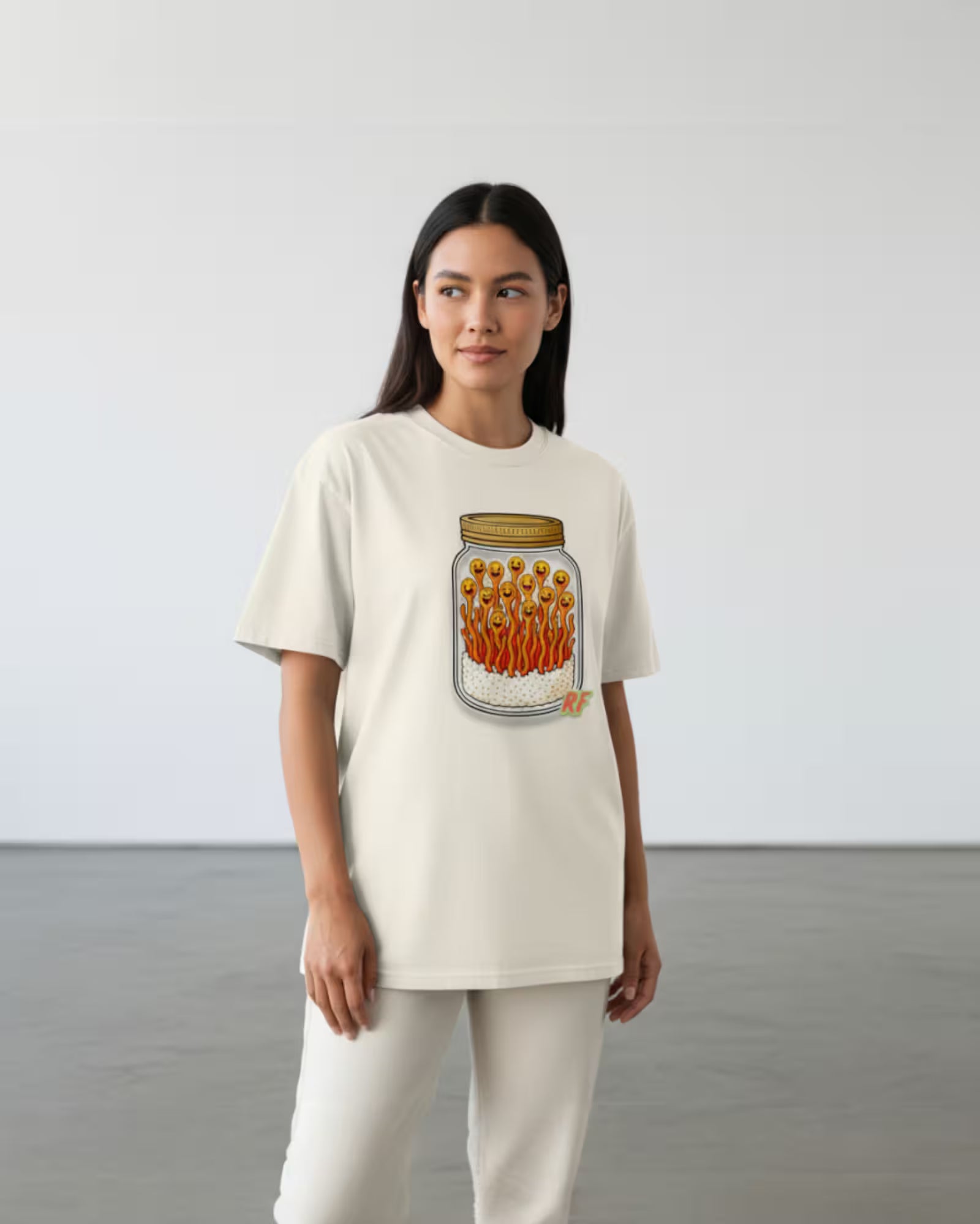 cartoon jar of orange cordyceps mushrooms with smiling faces printed on oversized faded t-shirt