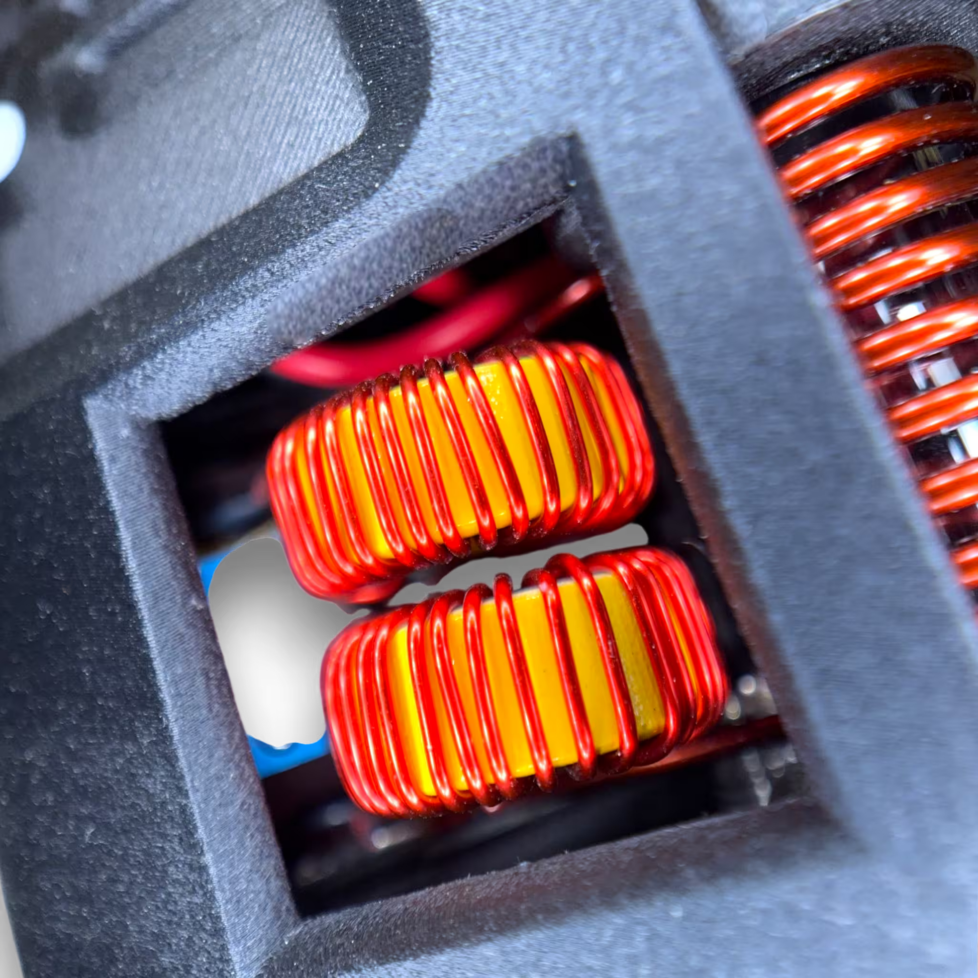Close-up of red and yellow inductors in a induction sterilizer