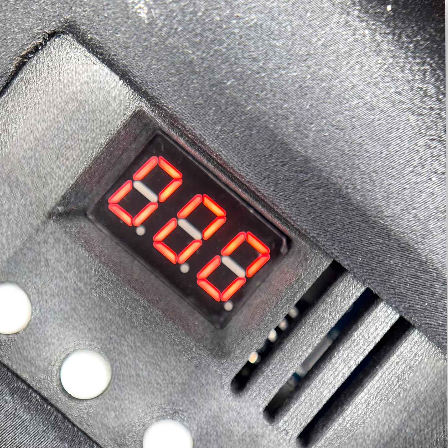 Digital display of an induction sterilizer with red LED digits on a black 3D printed surface