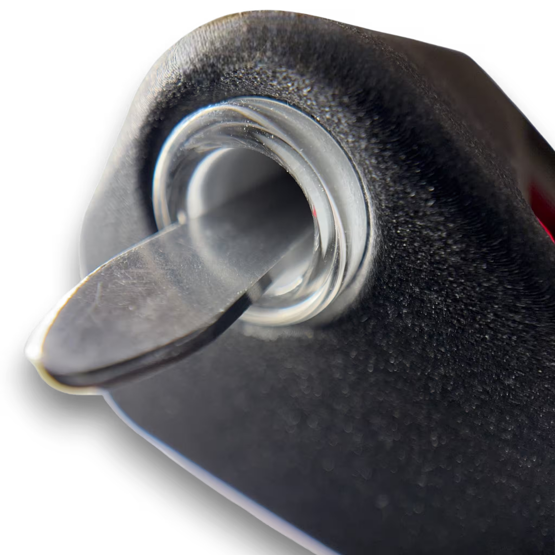 Close-up of an induction sterilizers tool housing with a scalpel resting inside on a transparent background