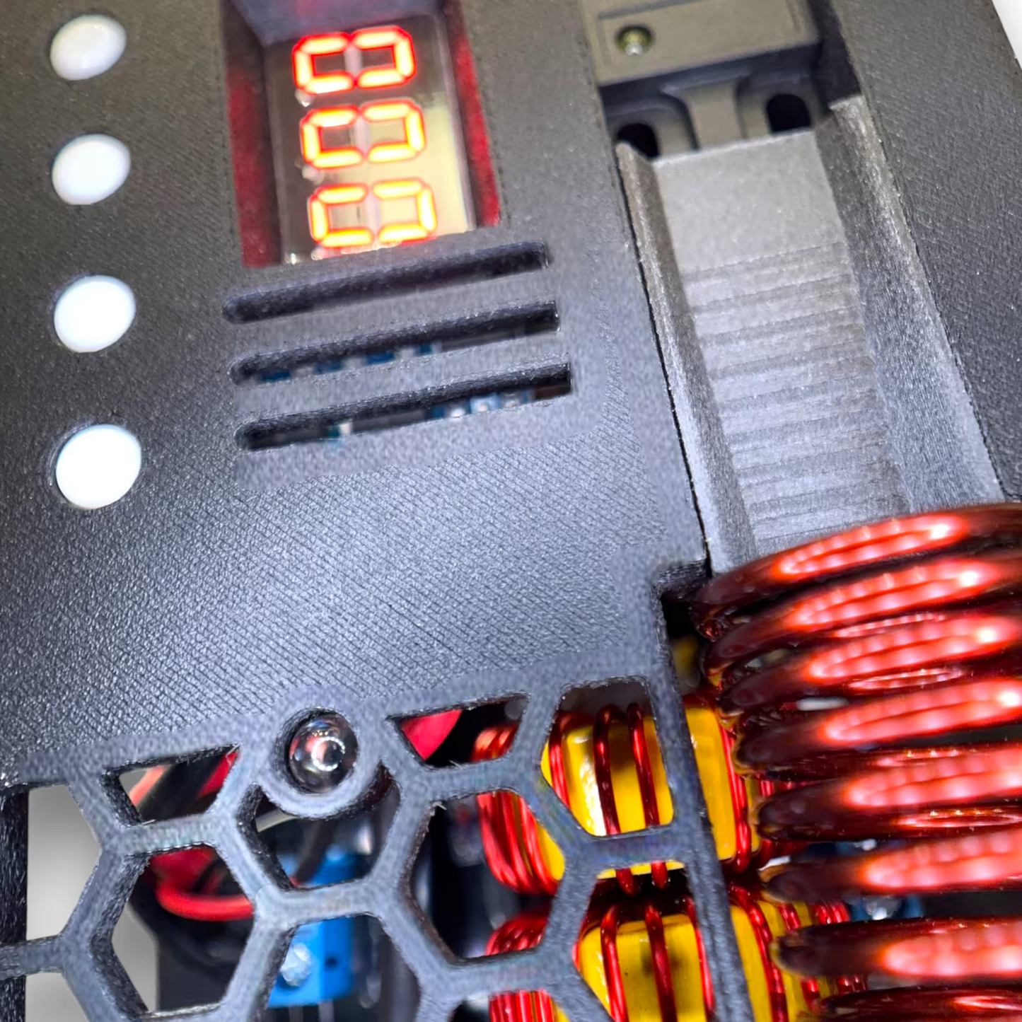 Close-up of a black automatic sterilizer with digital display and Copper coils