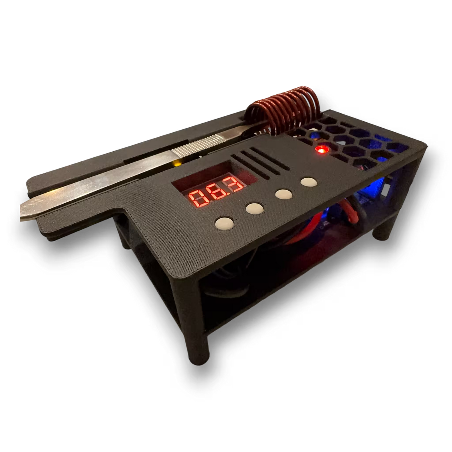 Automatic induction sterilizer with scalpel resting on top and digital display and coils on a black background