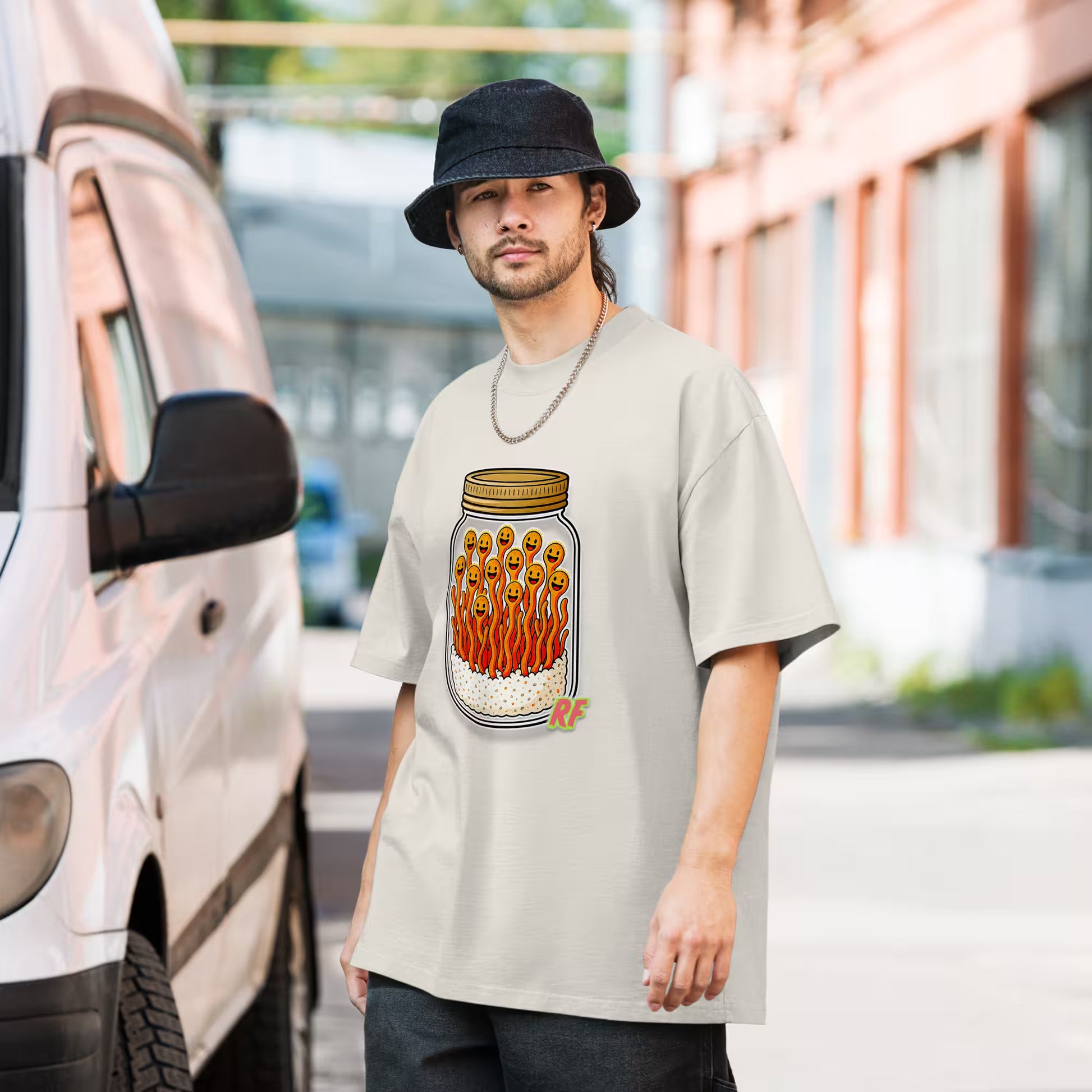 cartoon jar of orange cordyceps mushrooms with smiling faces printed on oversized faded t-shirt