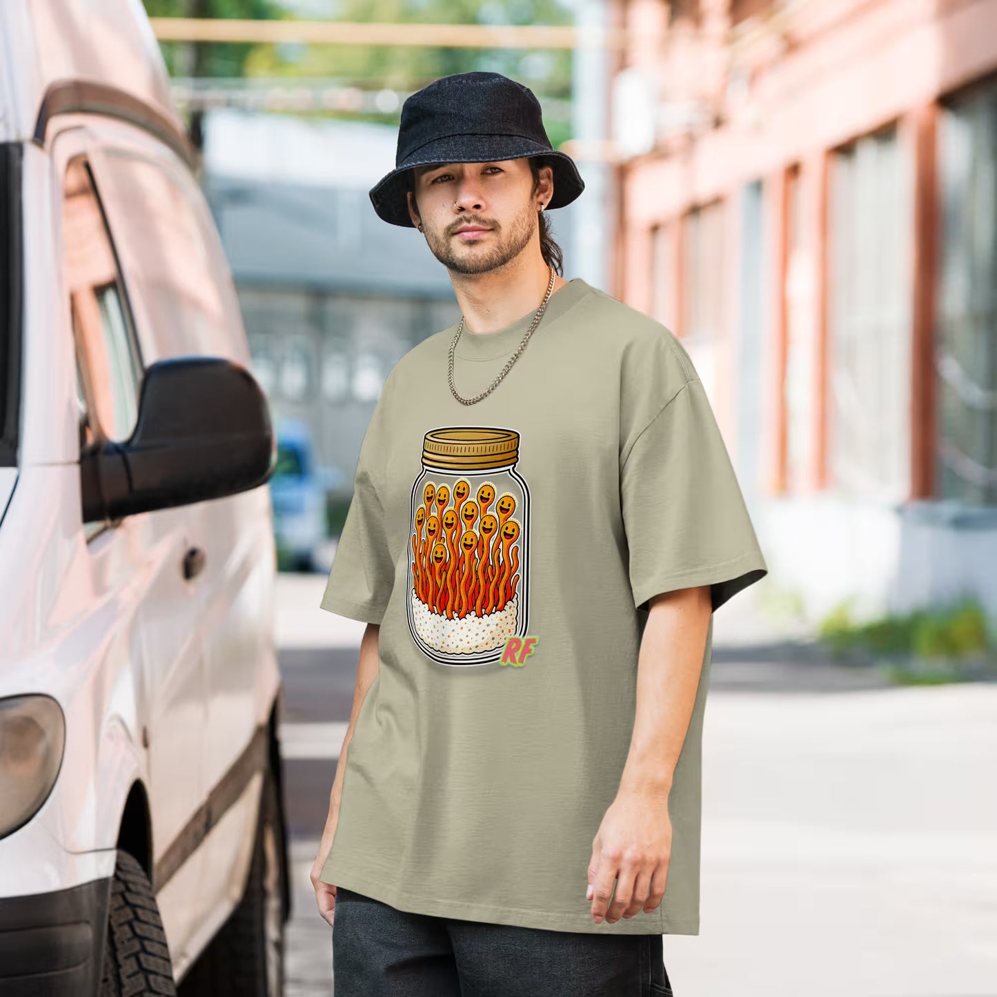 cartoon jar of orange cordyceps mushrooms with smiling faces printed on oversized faded t-shirt