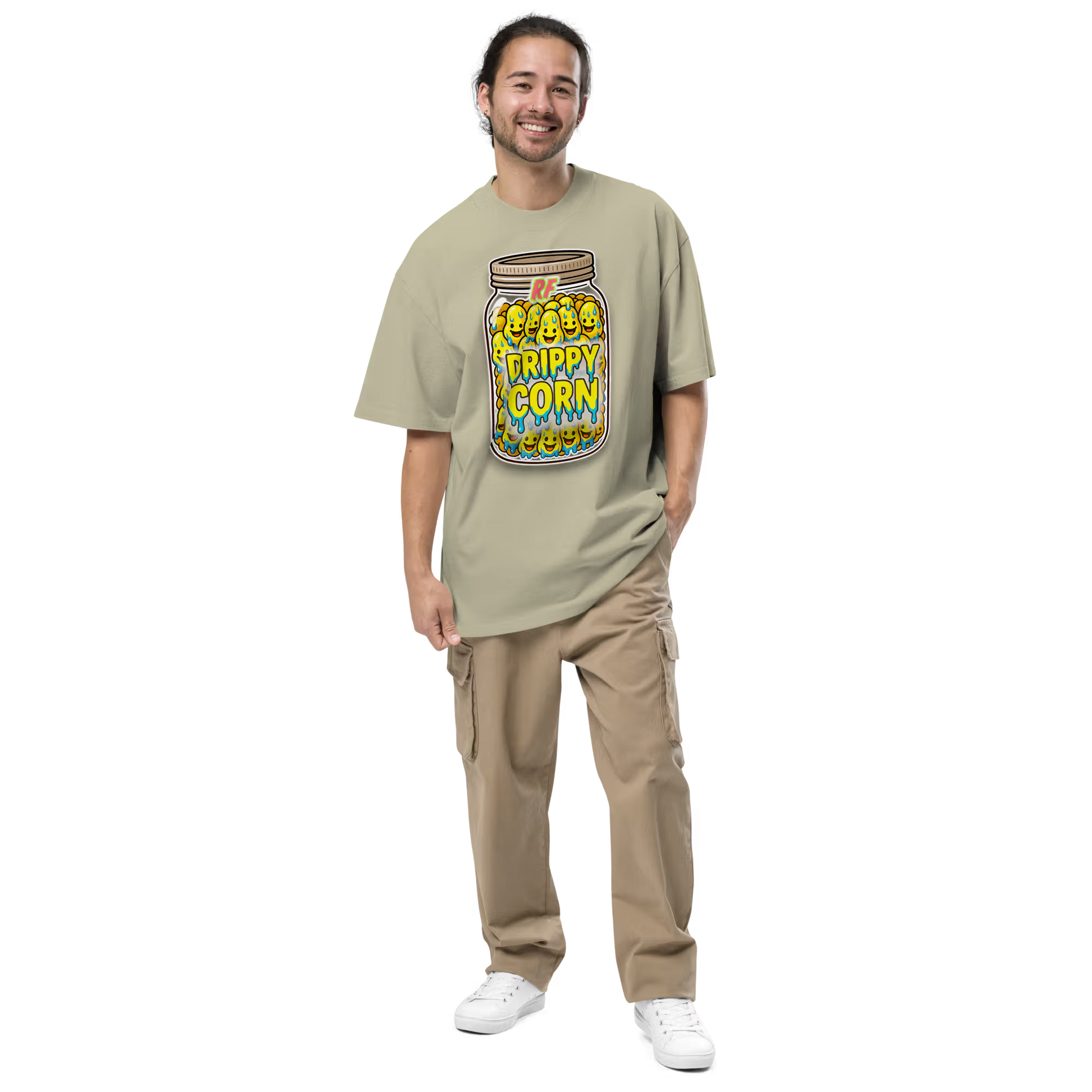 Person wearing a faded eucalyptus oversized t-shirt with a 'Drippy Corn' graphic design