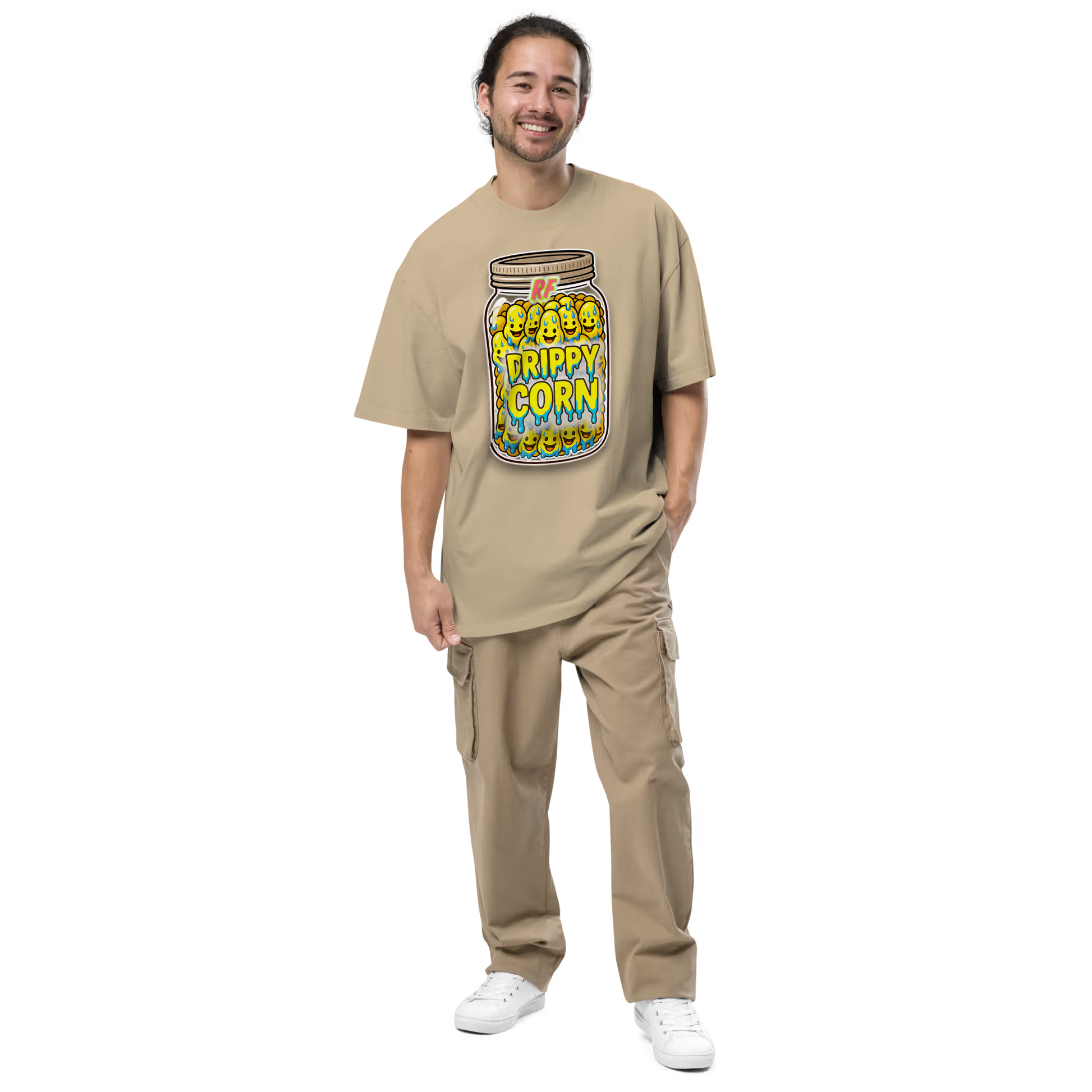 Person wearing a faded khaki oversized t-shirt with a 'Drippy Corn' graphic design 